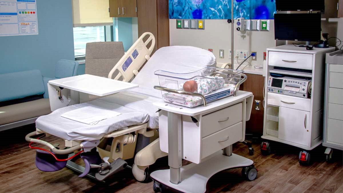 Labor and Delivery Room with Bassinet, Overbed Table, and Fetal Cart