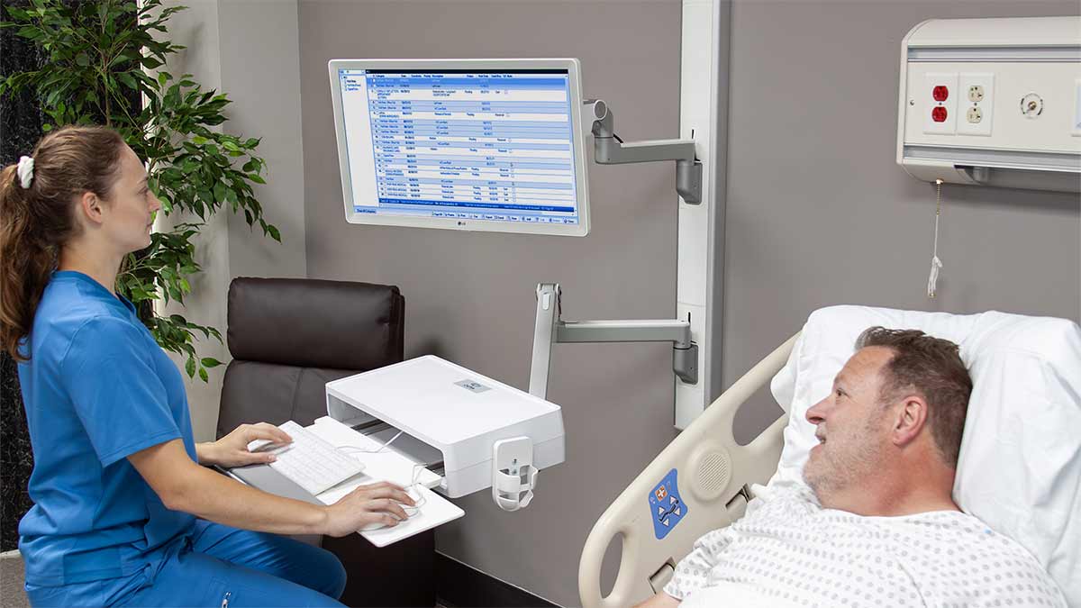 Clinician Charting at Wall Mount Workstation
