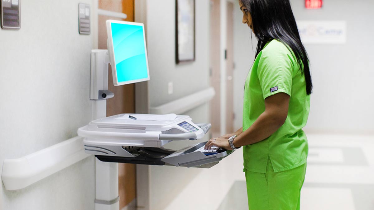 hospital-computer-cart-nurse Hospital computer cart with nurse charting